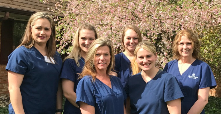 Staff In Front of Tree